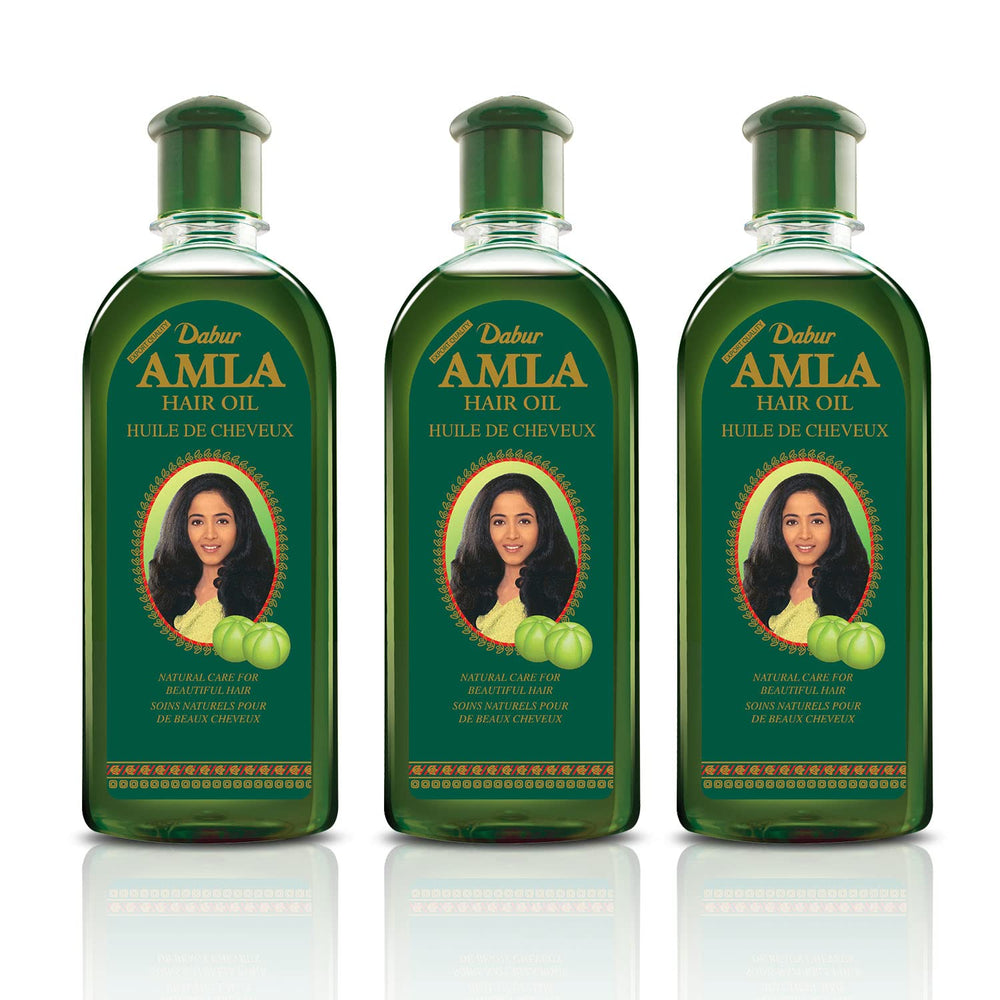 Dabur Amla Hair Oil, application-massage, facilite le soin et stimule l'éclat naturel.