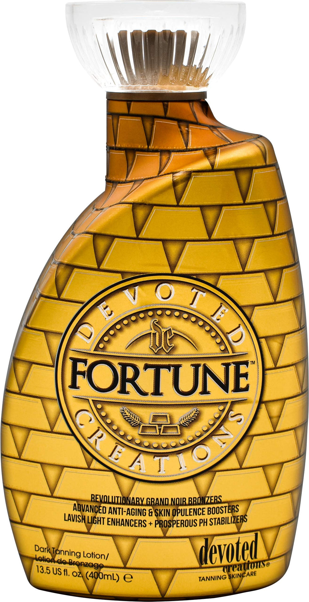 Fortune Bronzer Devoted Creations, emballage luxueux et parfum Cashmere Glow pour une expérience sensorielle.