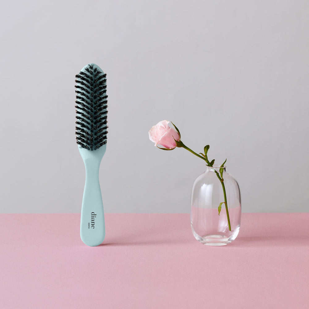 Brosse Diane idéale pour queues-de-cheval et chignons rapides.