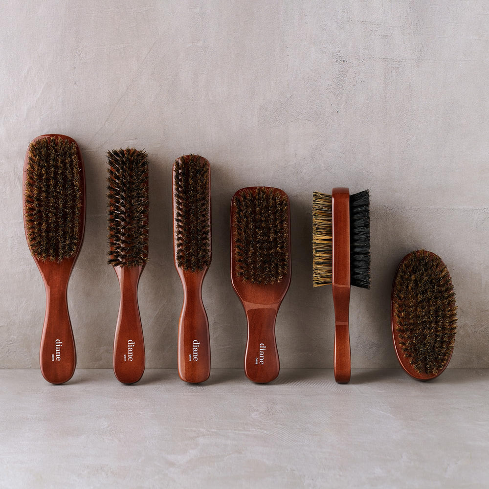 Diane Premium distribue les huiles naturelles le long des cheveux