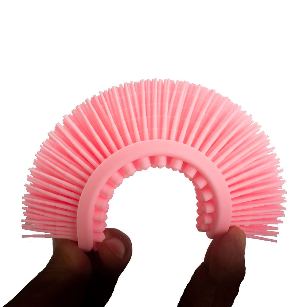 Brosse DNC à brins doux en silicone, idéale pour peau sensible.