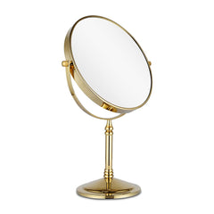 Miroir DOWRY 10x double-face en or, idéal pour les retouches précises.