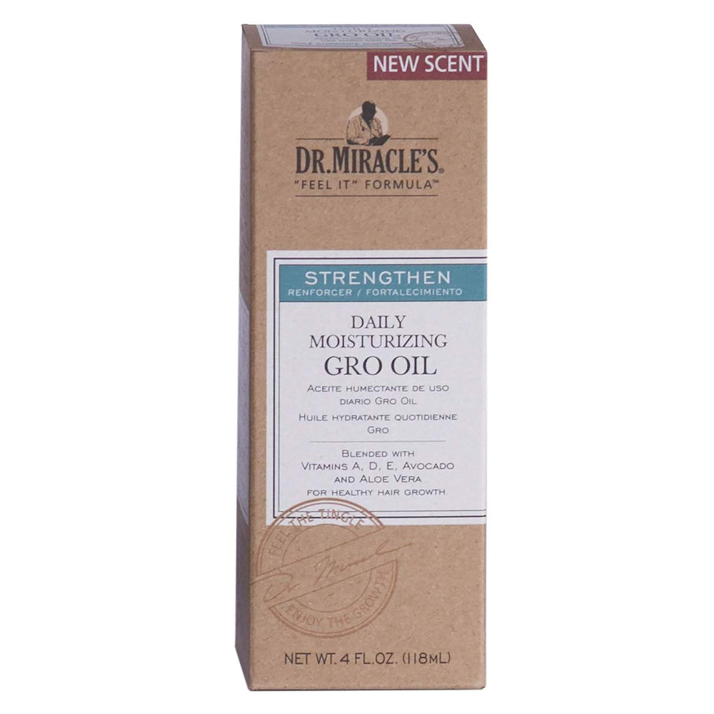 Application de Dr. Miracle's Gro Oil sur cheveux pour hydrater et lisser.
