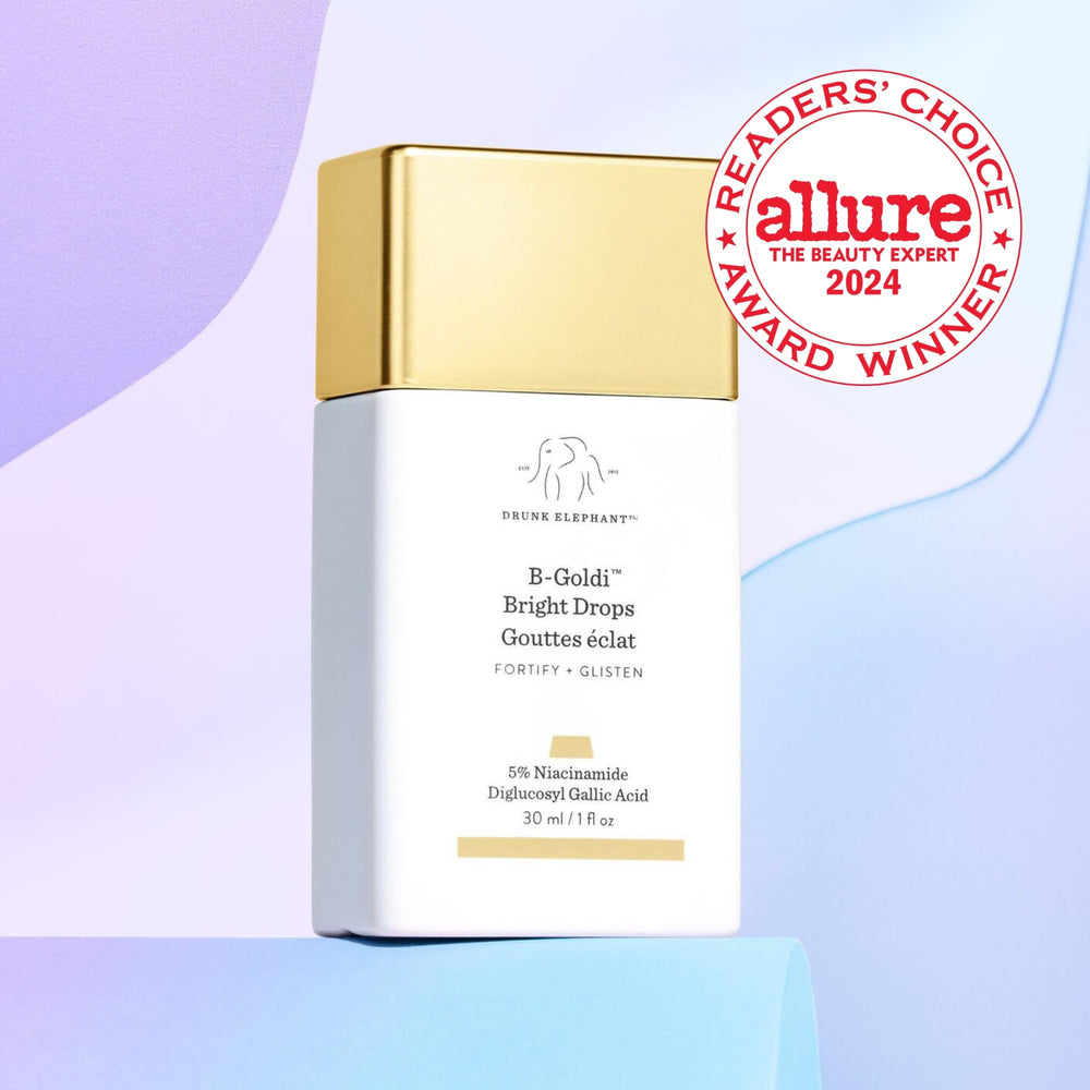 Goutte appliquée sur peau, démontrant l'éclat doré naturel de B-Goldi Bright Drops.