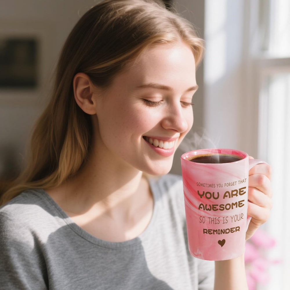 Tasse rose Eletorot avec inscription motivante, parfait pour des moments café relaxants.