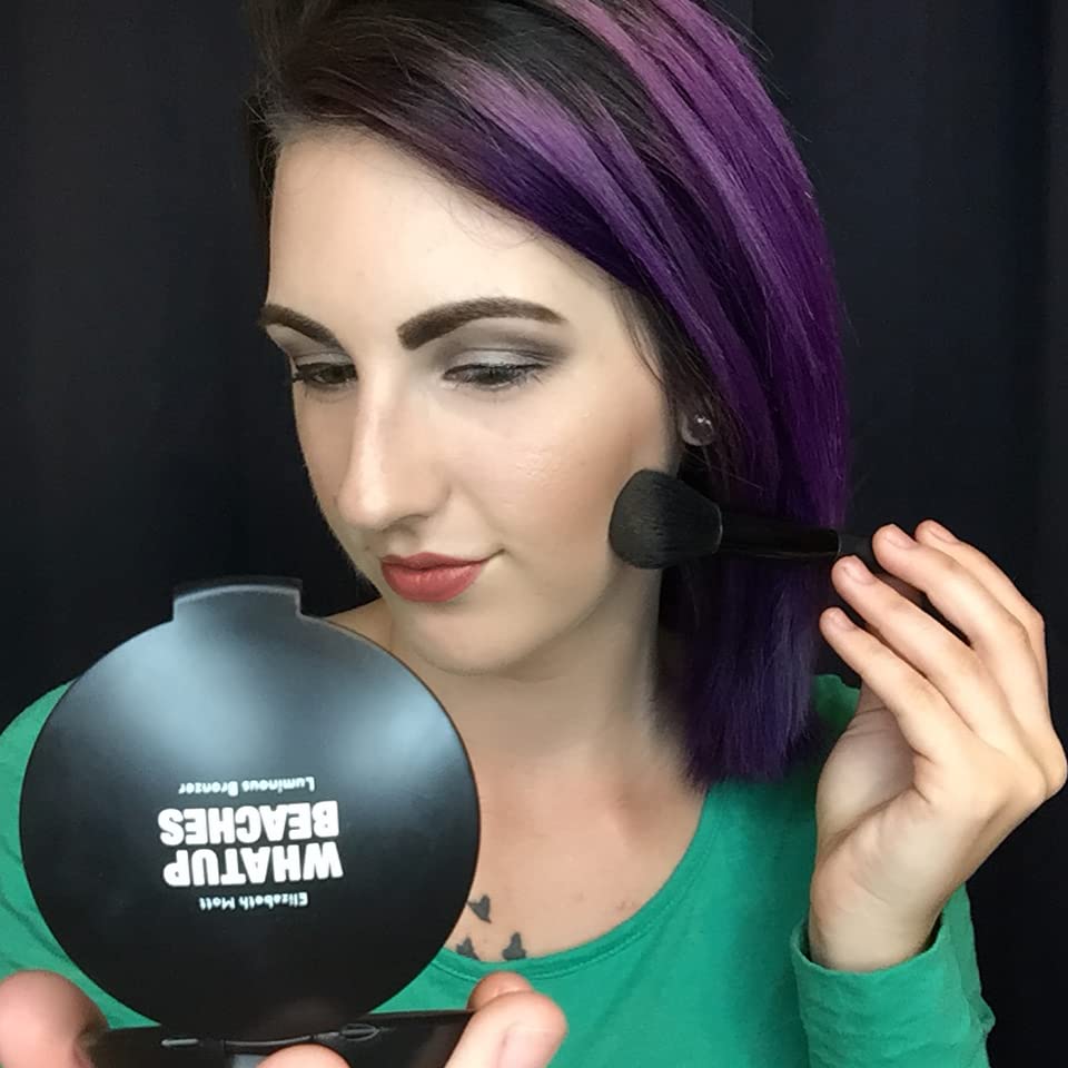 Elizabeth Mott Whatup Beaches Bronzer contouring cheeks and jawline with warm definition.