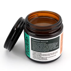 Fadelo Batana: goutte d'huile démontrant la texture légère pour les cheveux.
