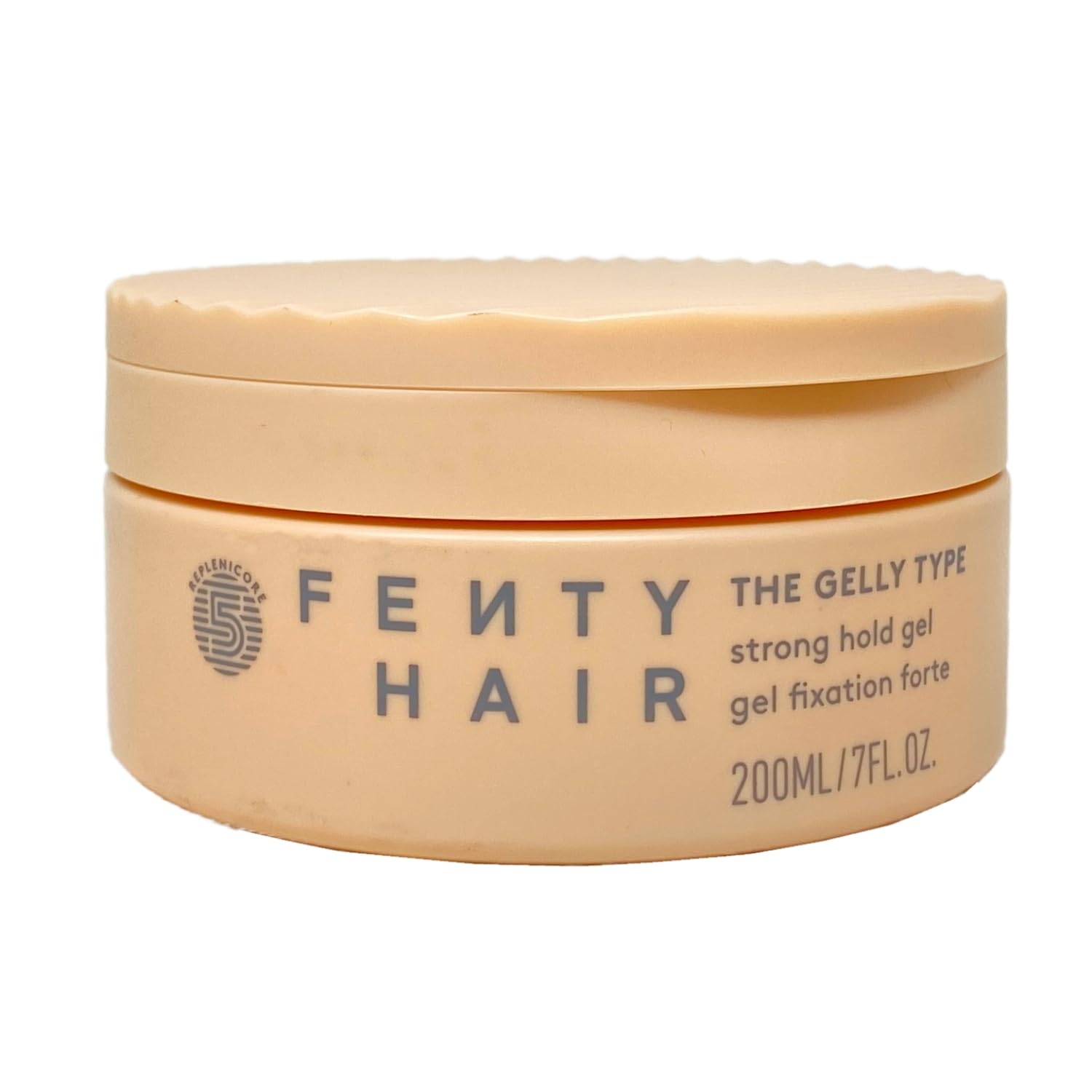 Bouteille du gel Fixation Forte Fenty Hair prête au coiffage longue tenue.