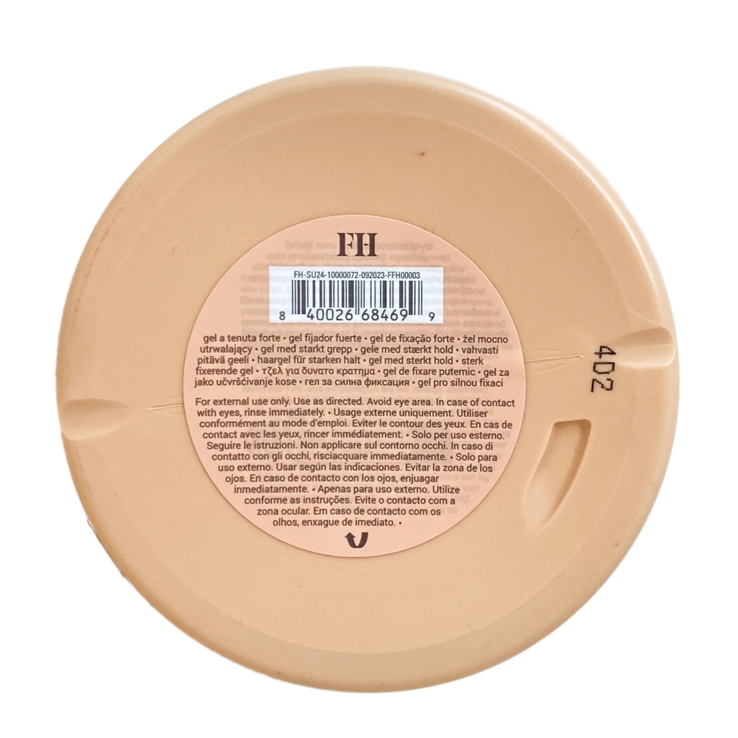 Packaging élégant et parfum ambré floral du gel Fixation Forte Fenty Hair.