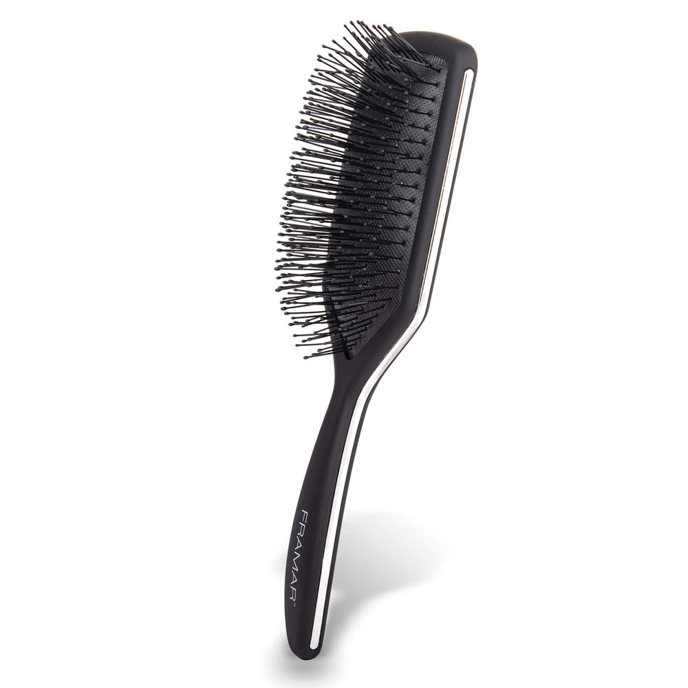 Brosse FRAMAR palette noire démêlage efficace pour cheveux épais et bouclés.