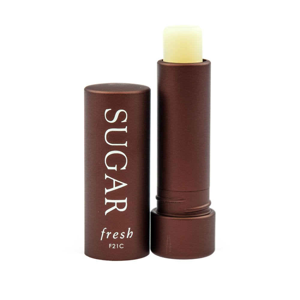 Fresh soin lèvres SPF 15, flacon clair, hydratant et protecteur.