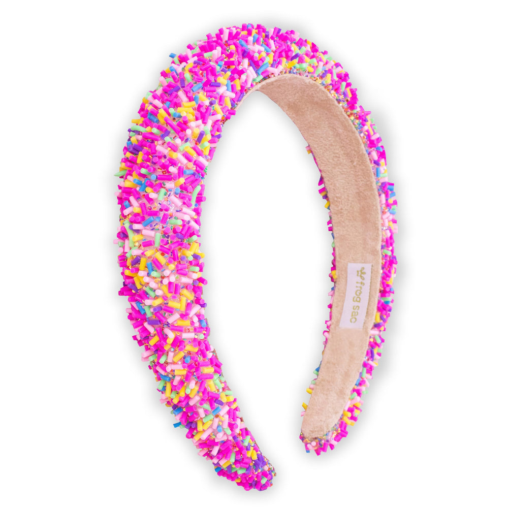 Bandeau FROG SAC pour enfants avec confettis arc‑en‑ciel et rembourrage, maintien confortable.