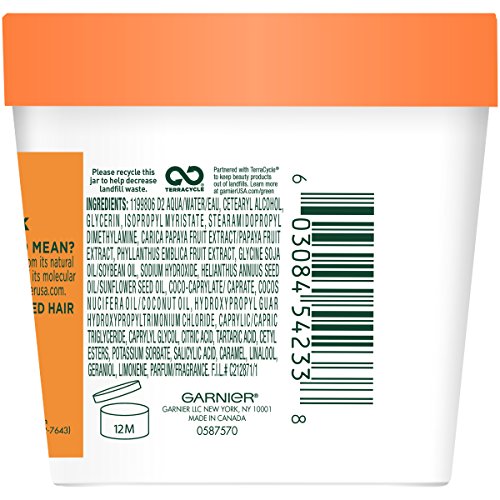 Texture crème du masque Papaye Garnier Fructis prête à être appliquée en douceur