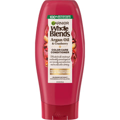 Flacon Garnier Whole Blends Color Care Conditioner avec huile d’argan et canneberge, hydratation et couleur protégée.