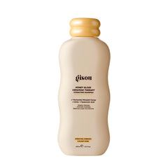 Gisou Honey Gloss Ceramide Therapy Shampoo - Bouteille chic et hydratante pour cheveux propres.
