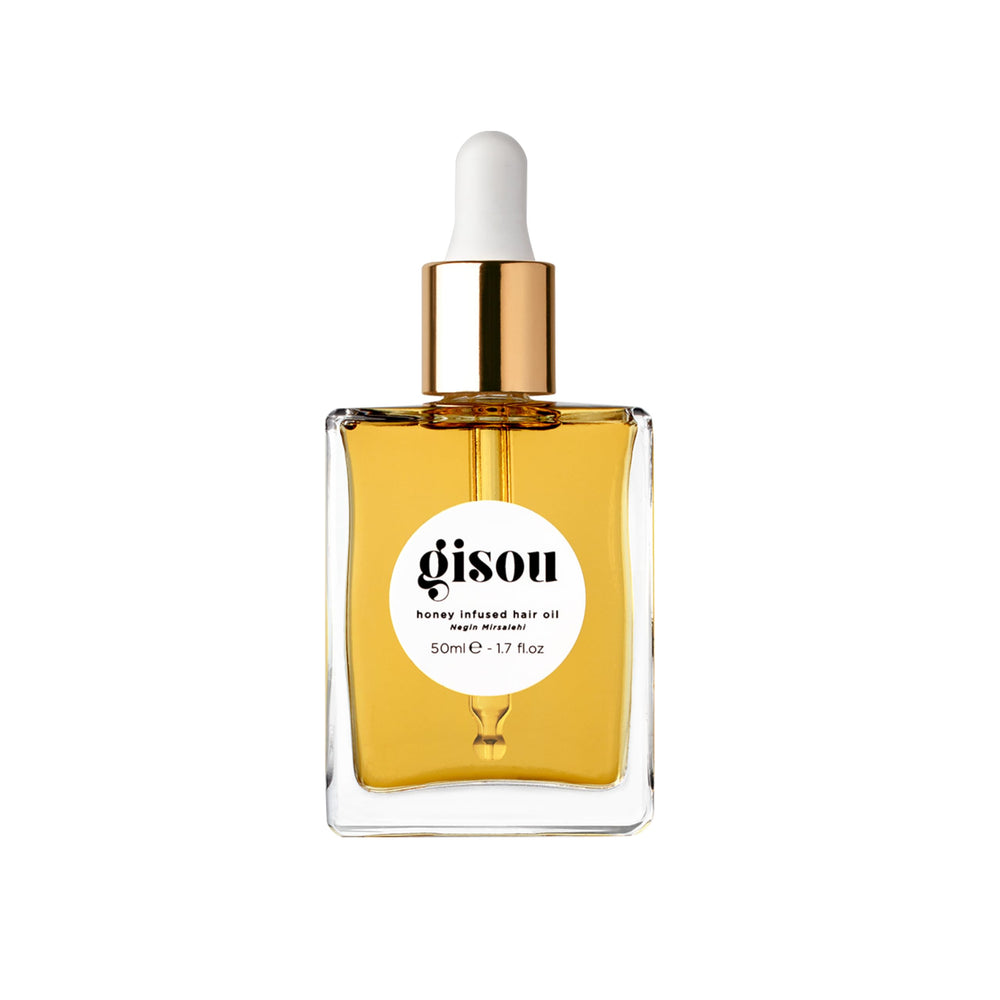 Gisou huile capillaire au miel, bouteille élégante, hydratation durable et brillance.