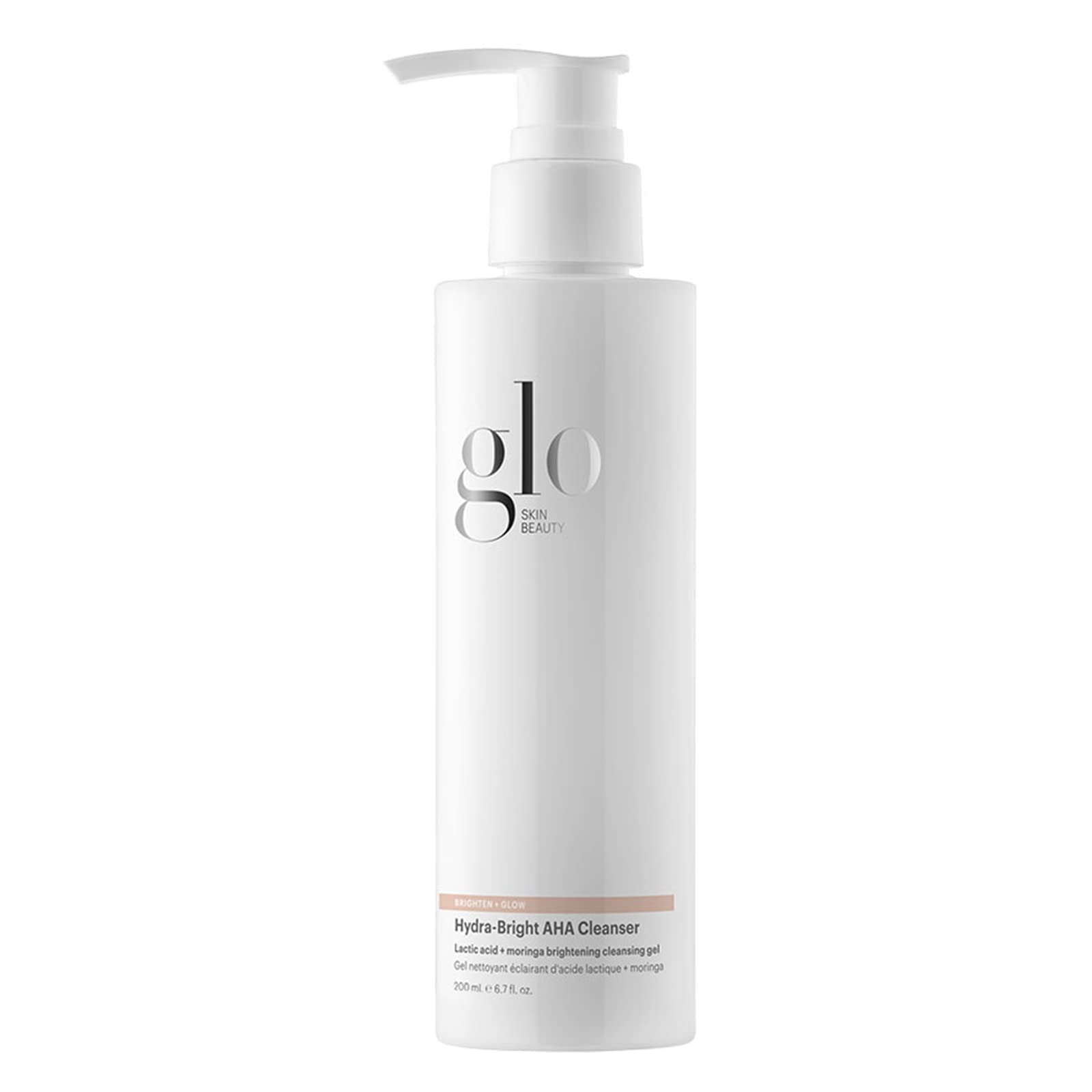 Glo Skin Beauty Hydra-Bright AHA Cleanser: bouteille et mousse nettoyante douce pour peau sensible.