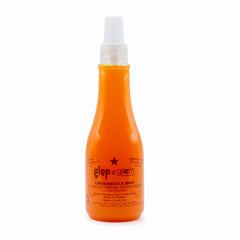 Glop & Glam démêlant crème orange – bouteille visible, démêle rapidement les nœuds sans résidu.