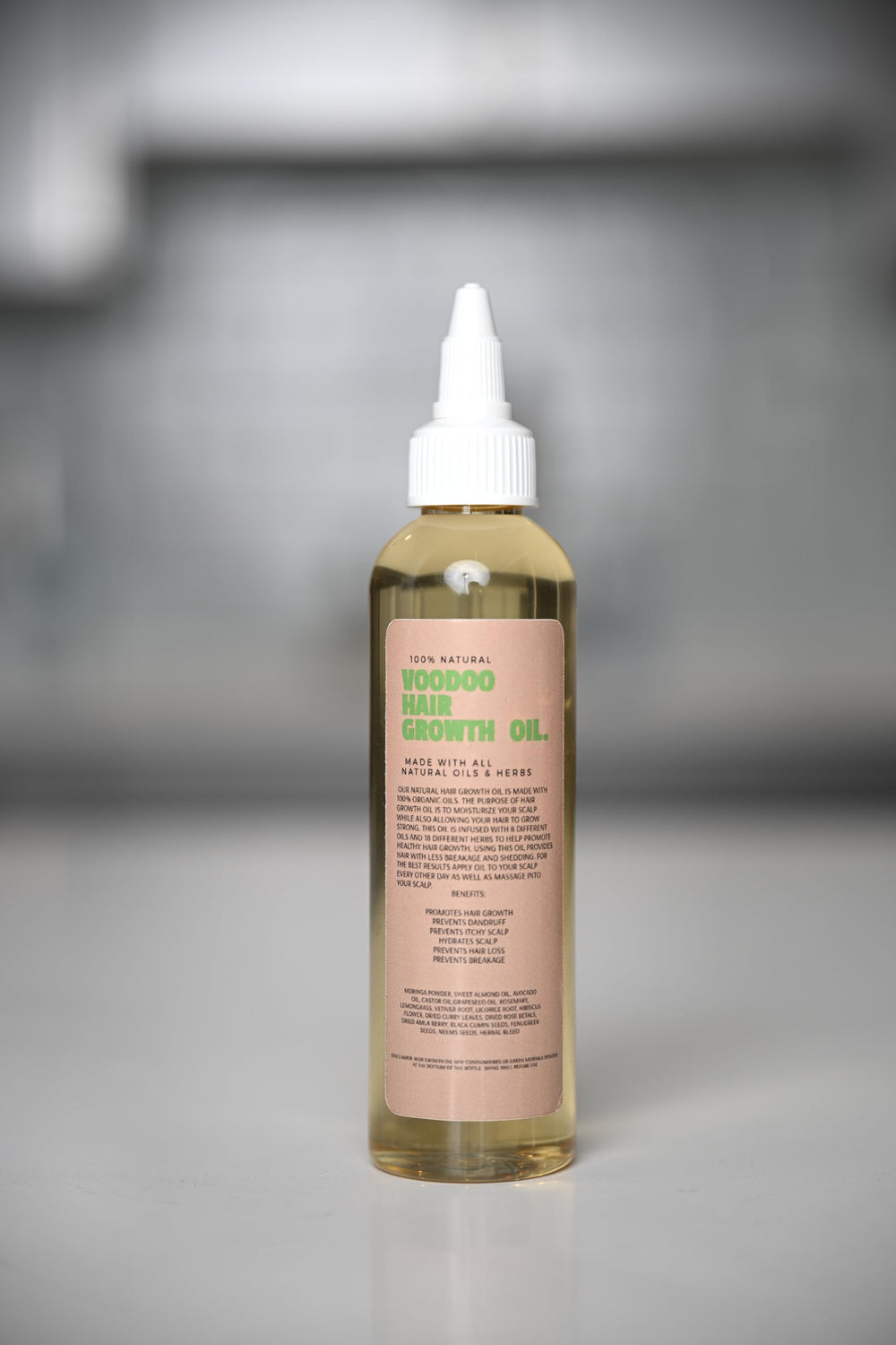 Glossed by Nae Voodoo Hair Growth Oil, usage régulier pour cheveux et cuir chevelu.