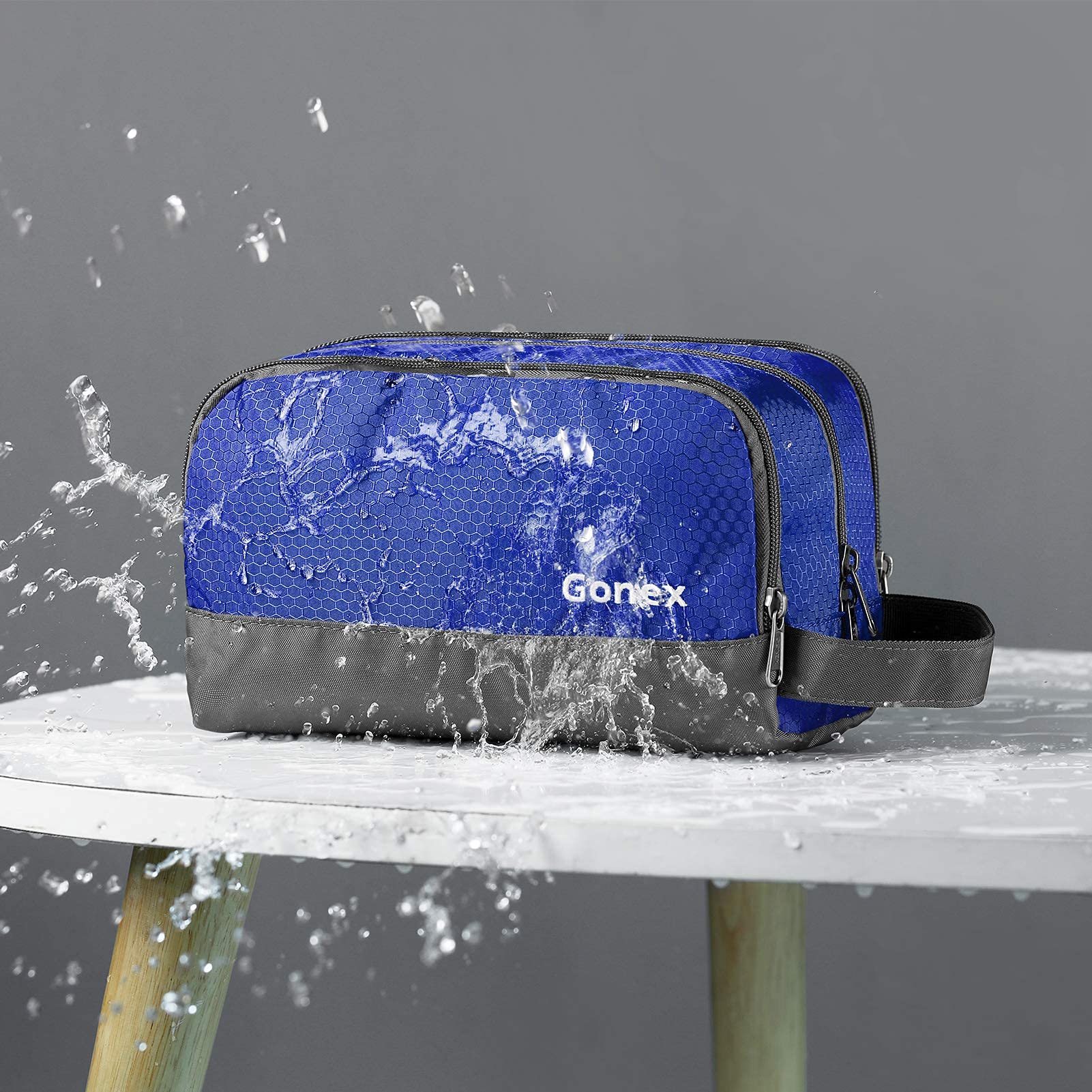 Gonex trousse bleu ouverte, montre les compartiments principaux et la poche filet.