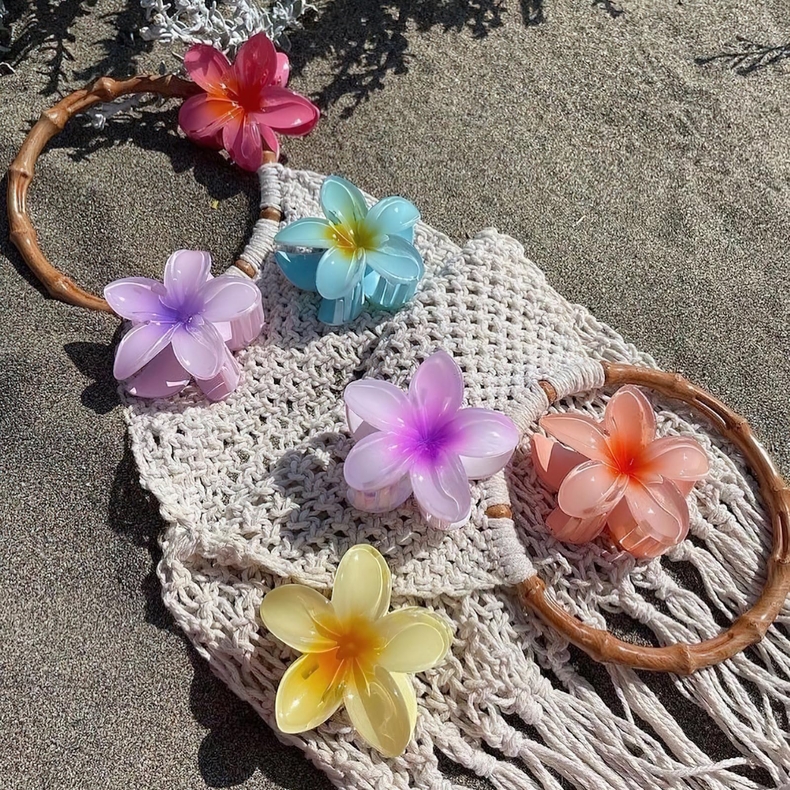 GQLV clip fleurs – parfait pour plage et soirées élégantes.