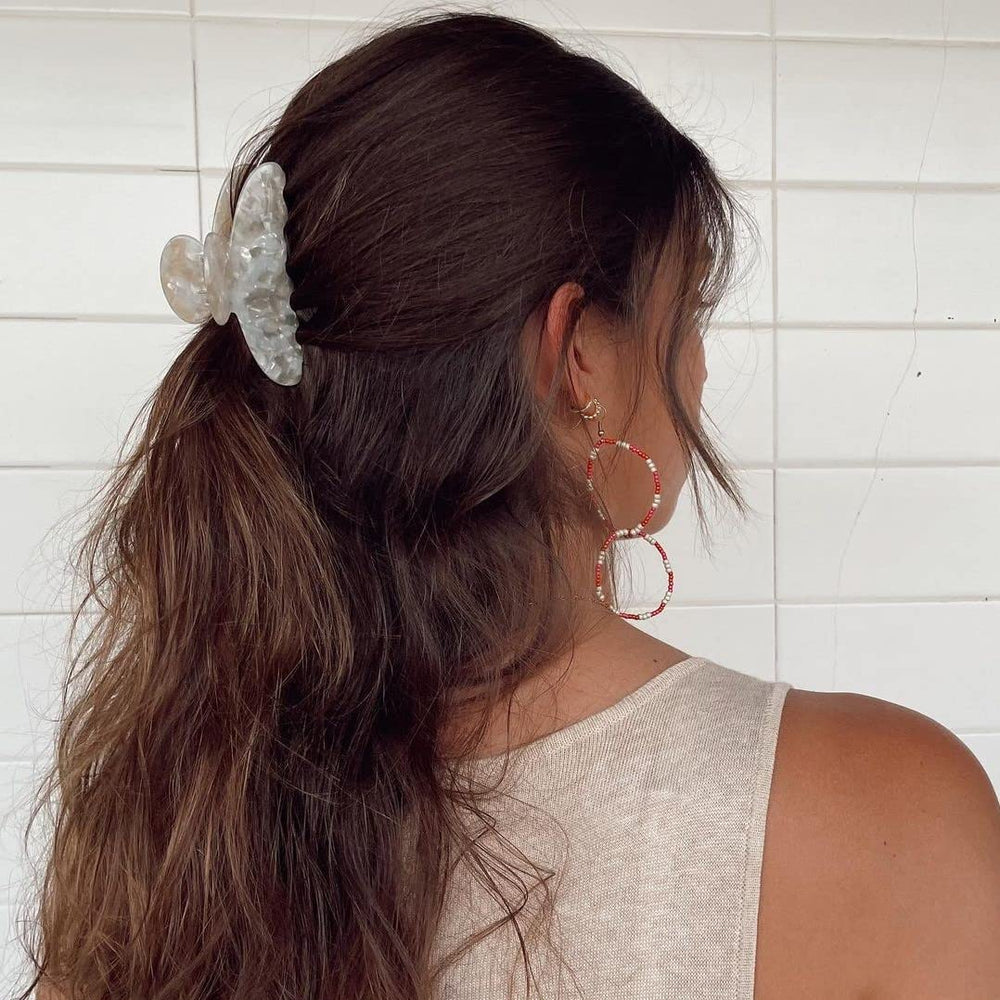 Barrette banane HAIMEIKANG marbre, style unique pour cheveux variés.