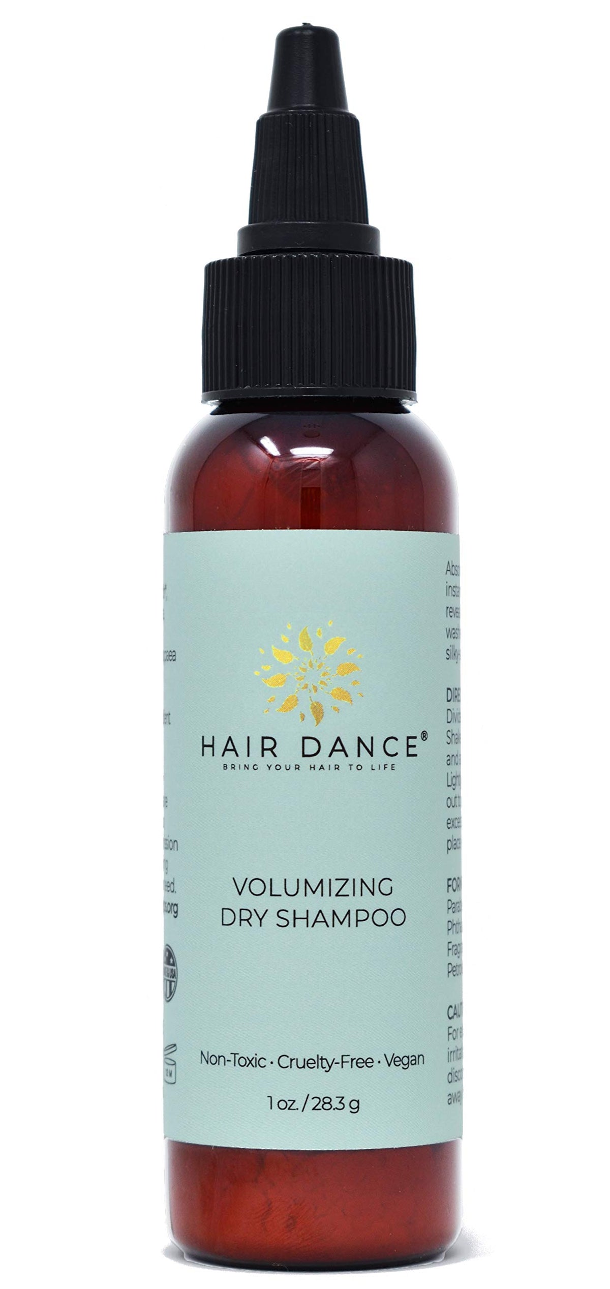 Hair Dance Poudre Volume: bouteille visible pour des racines fraîchement volumisées.