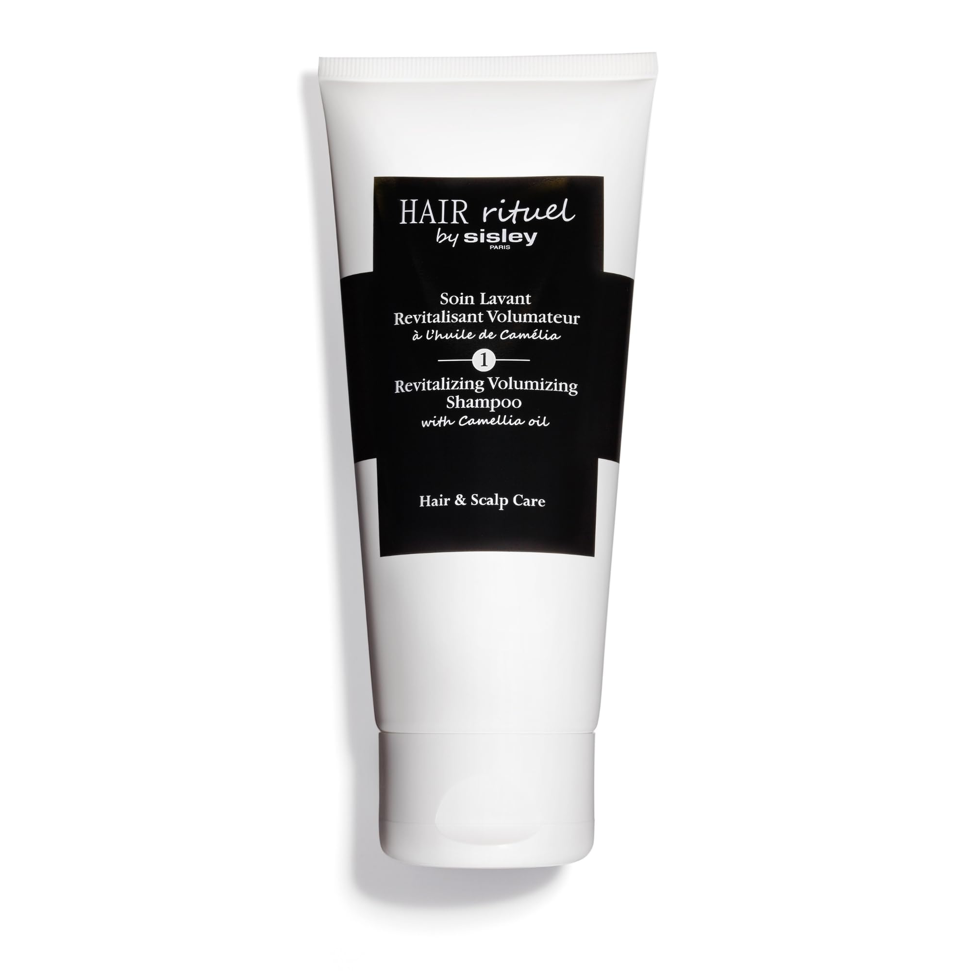 Hair Rituel par Sisley Shampoo Volumisant Camellia — revitalise les cheveux et apporte du volume durable.