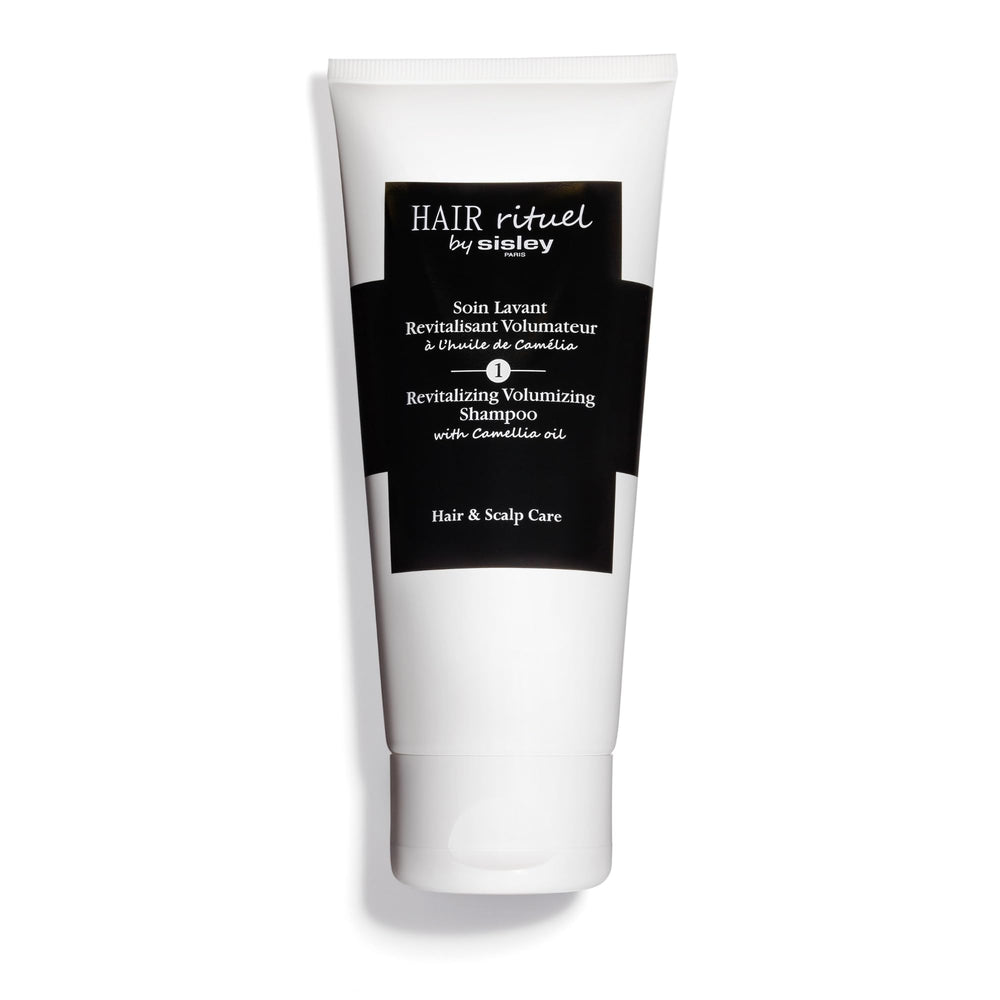 Hair Rituel par Sisley Shampoo Volumisant Camellia — revitalise les cheveux et apporte du volume durable.