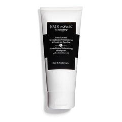 Hair Rituel par Sisley Shampoo Volumisant Camellia — revitalise les cheveux et apporte du volume durable.