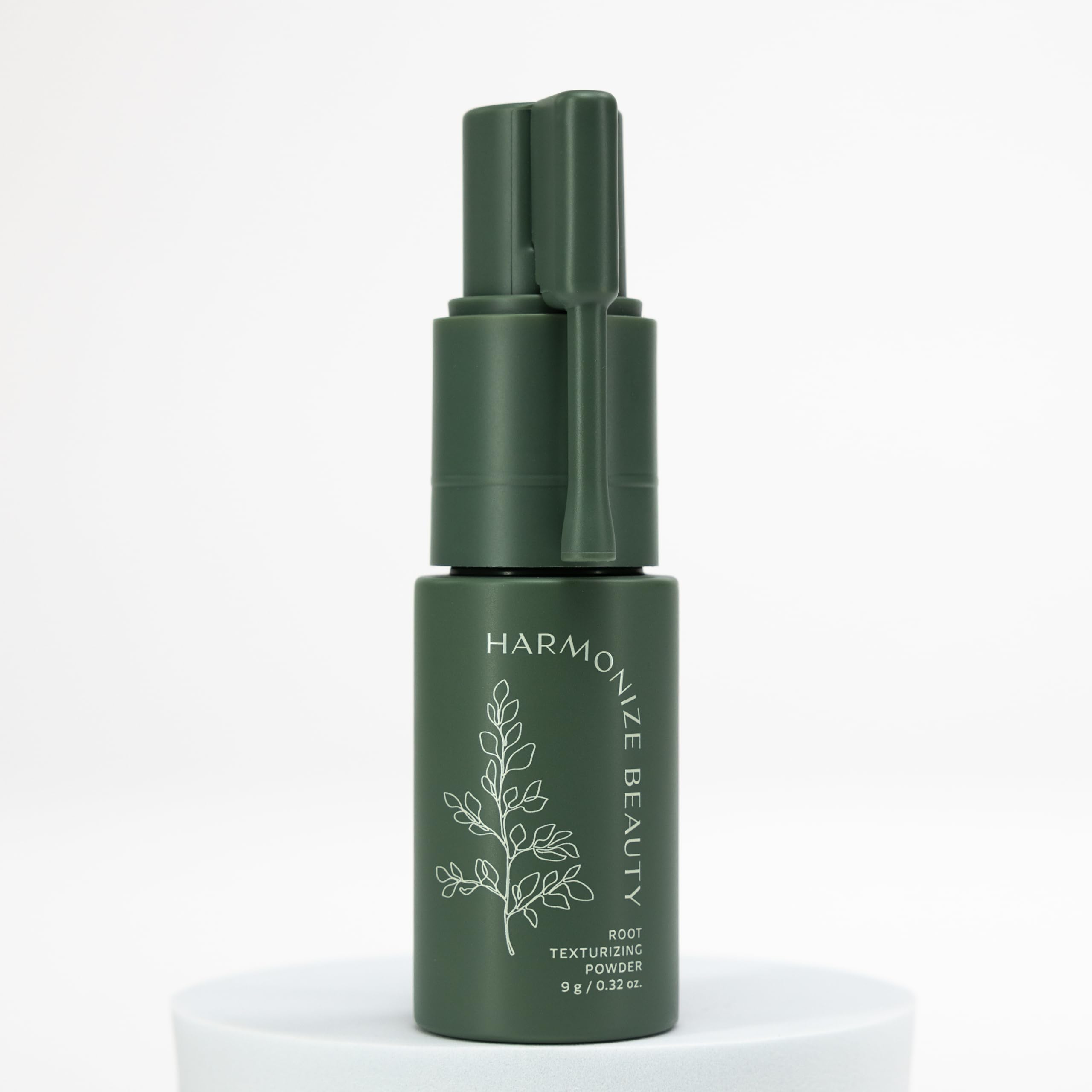 Bouteille Harmonize Beauty, poudre texturante idéale pour réapplication et lifting discret.