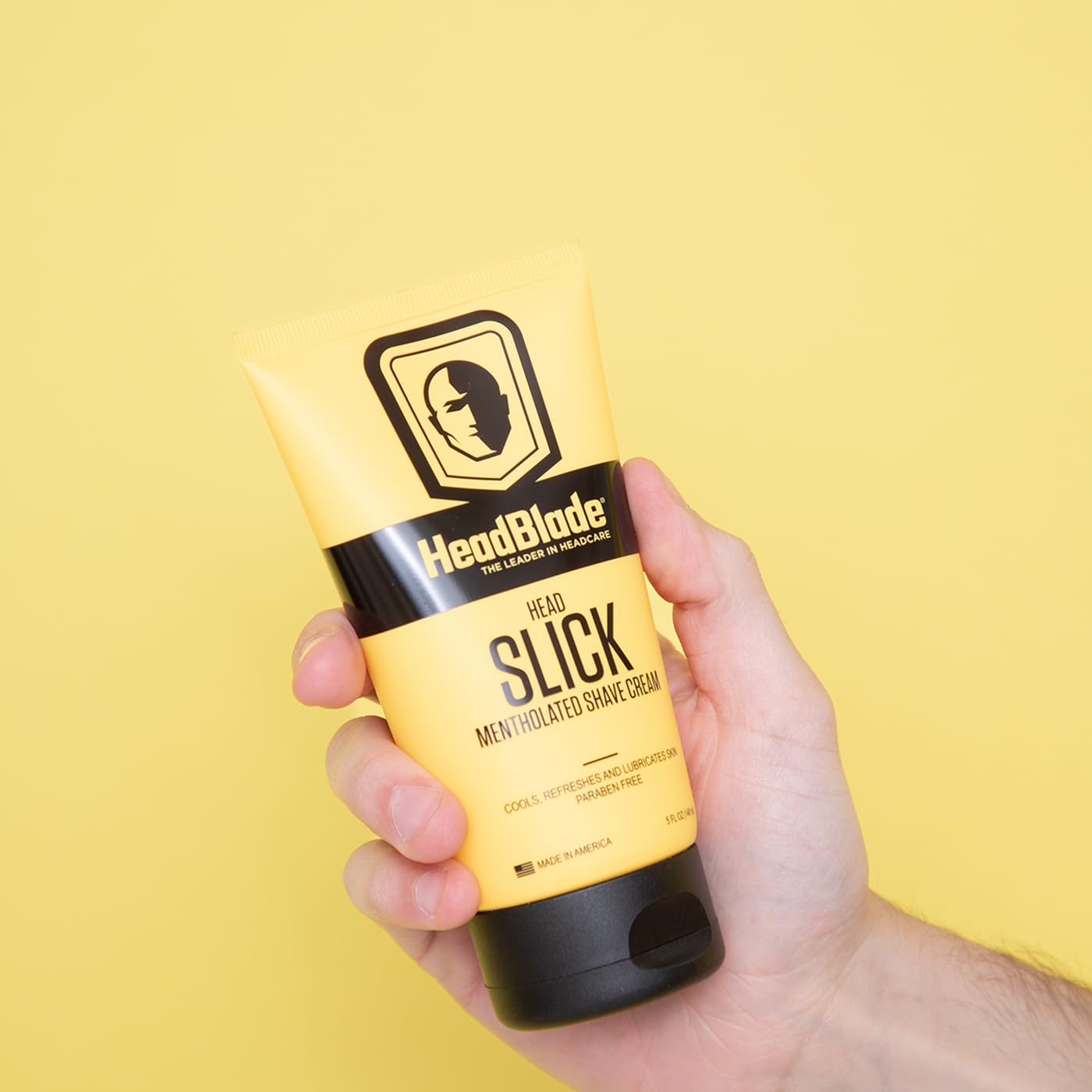 Flacon HeadSlick affichant texture lisse et glisse fluide.