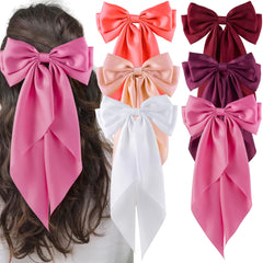 Pinces hisial avec gros nœud rose satiné pour une allure élégante durable.