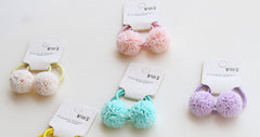 Hot&Sattion bandes elastiques bébé fleurs jaunes, accessoire pratique pour coiffure rapide.