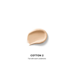 Hourglass Vanish Airbrush Concealer appliqué sur peau pour corriger cernes et imperfections.