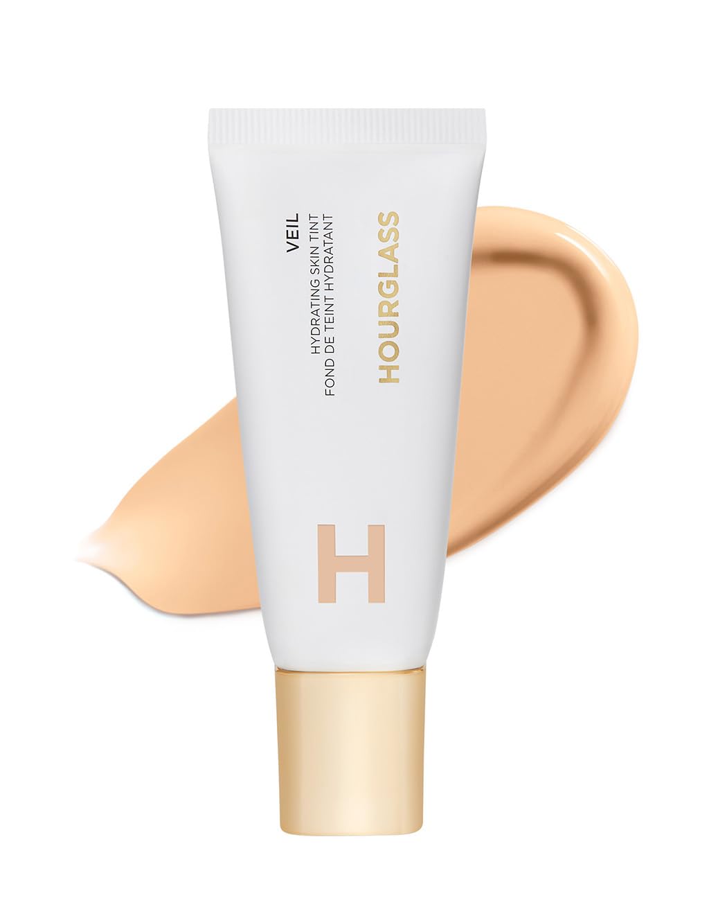 Hourglass Veil Hydrating Skin Tint – bouteille élégante avec fini lumineux et hydratant.