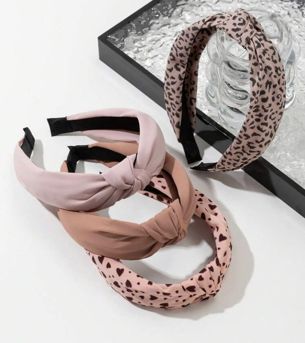 Huachi bandeau imprimé léopard rose, touche audacieuse et modeur fonctionnel.