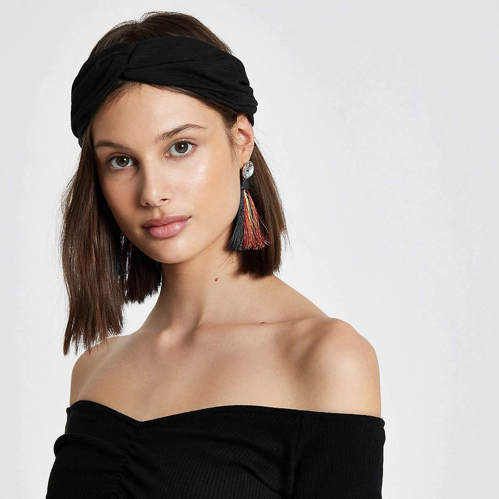 Huachi bandeau turban extensible offrant confort et maintien sûr lors d’activités légères.