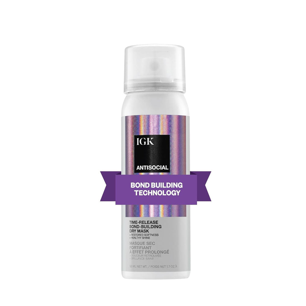 IGK Antisocial bond-building dry hair mask bottle with travel-ready design for on-the-go care