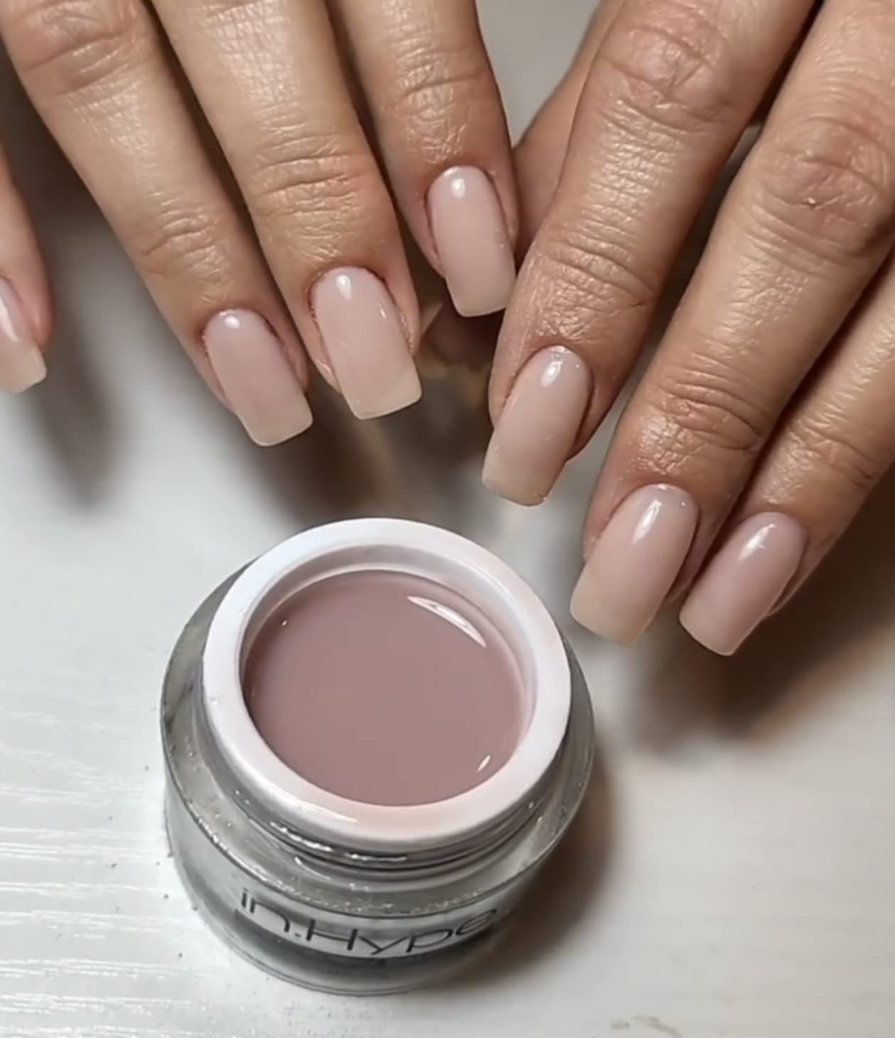 IN.HYPE UV/LED Camouflage Builder Gel nude finish with lavender undertone on natural nails.
