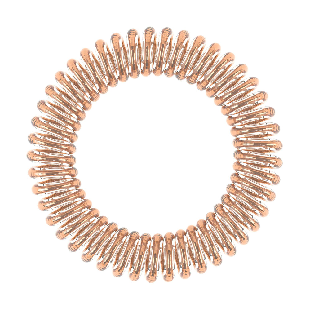 invisibobble SLIM Bronze Me Pretty portée comme bracelet, accessoire élégant et pratique