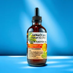 Application sur le cuir chevelu avec l'huile ricin noire Jamaican Mango & Lime