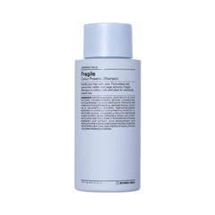 J Beverly Hills Blue Fragile: bouteille avec sauge protégeant la couleur lors de l'application.