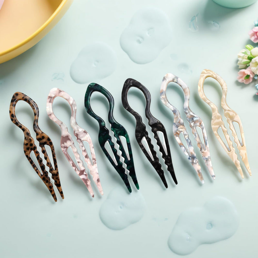 Cadeau idéal : ces épingles Jimmidy Prestige sublimant une coiffure festive.