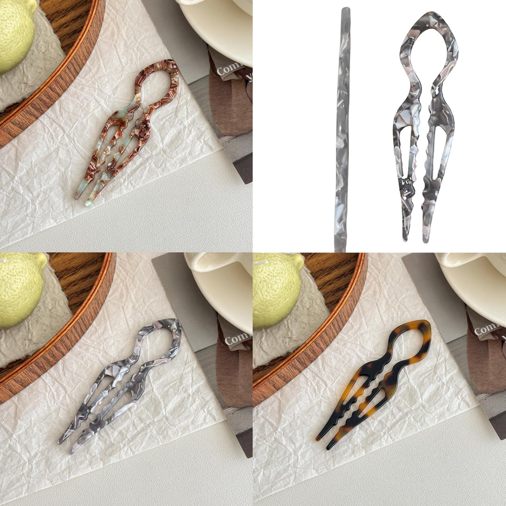 Épingle Jimmidy gris clair en forme U, apportant brillance et touche luxueuse.
