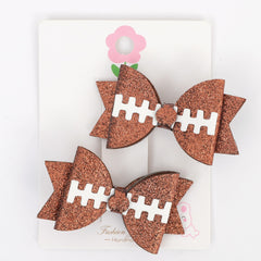 Barrette football brillant rose de JISSOO, parfaite pour photos festives et fêtes.