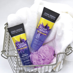 John Frieda Violet Crush purple pigments visibly neutralize brassiness in blonde hair.