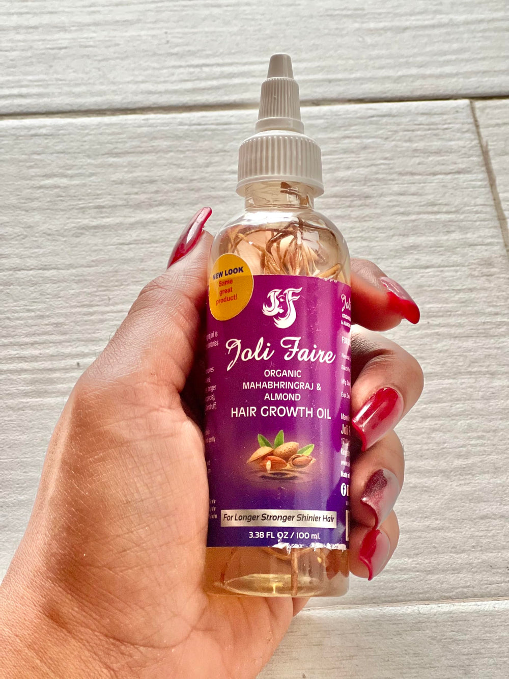 Joli Faire Hair huile croissance en bouteille, cheveux plus forts et nourris.