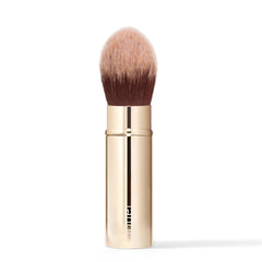 Brosse Jouer de voyage pour le teint, poils synthétiques doux et application précise.