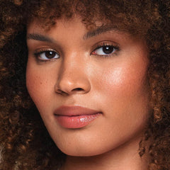 Jouer vegan lip enhancer vanilla swatch showing hydration and shine